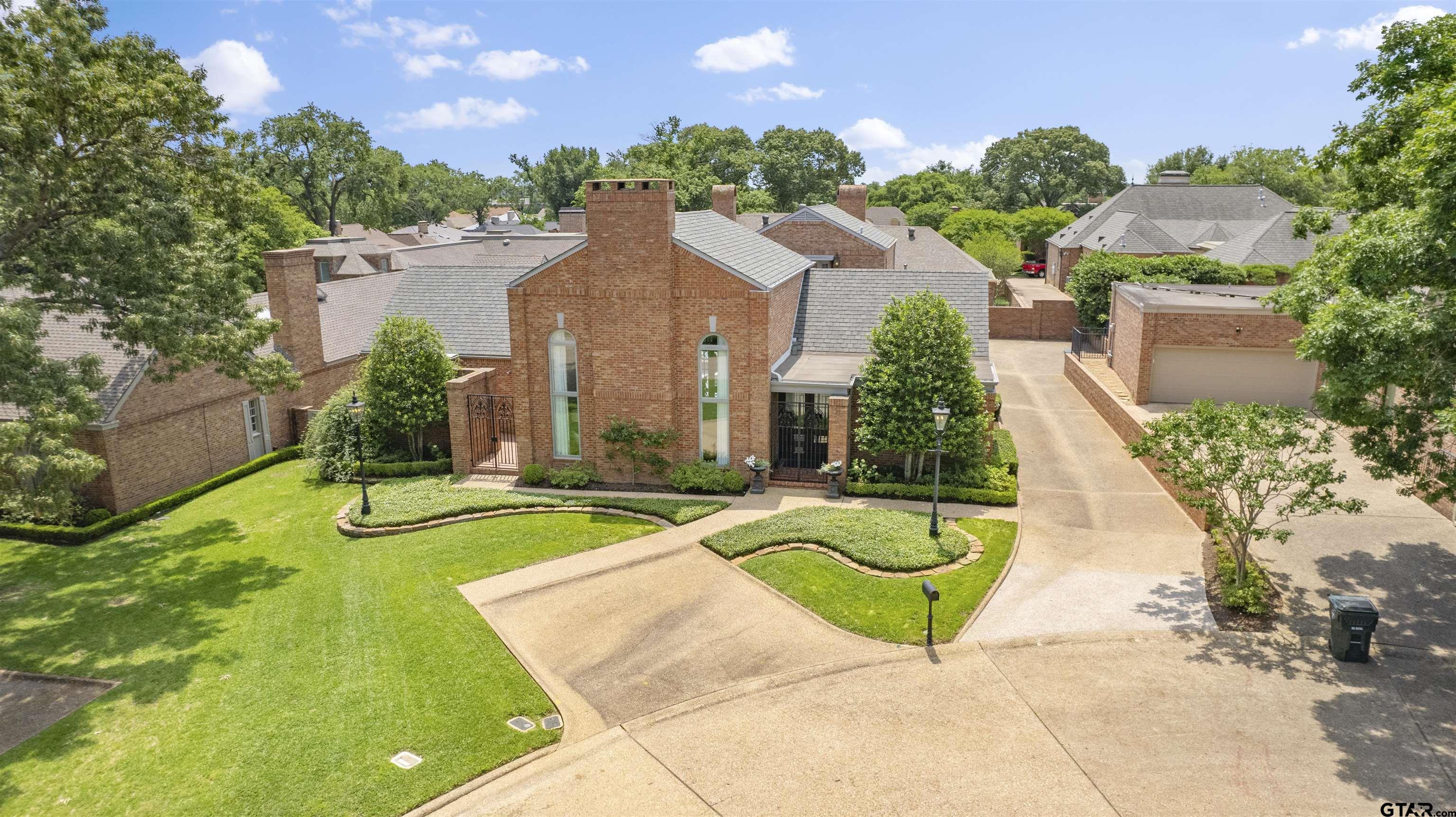 a view of a house with swimming pool and a yard