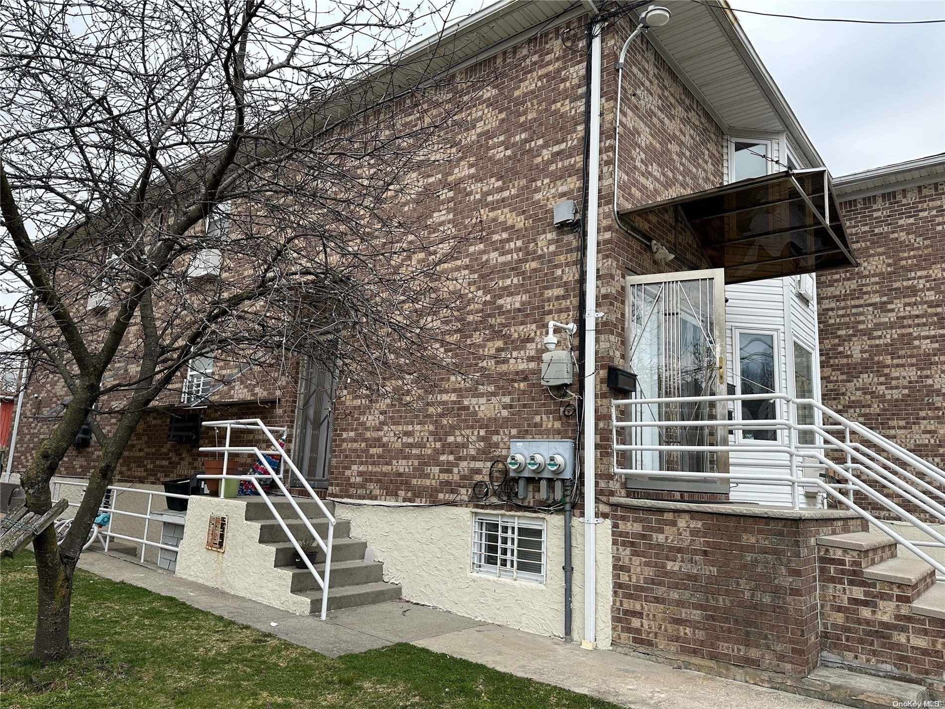 a front view of a house with stairs