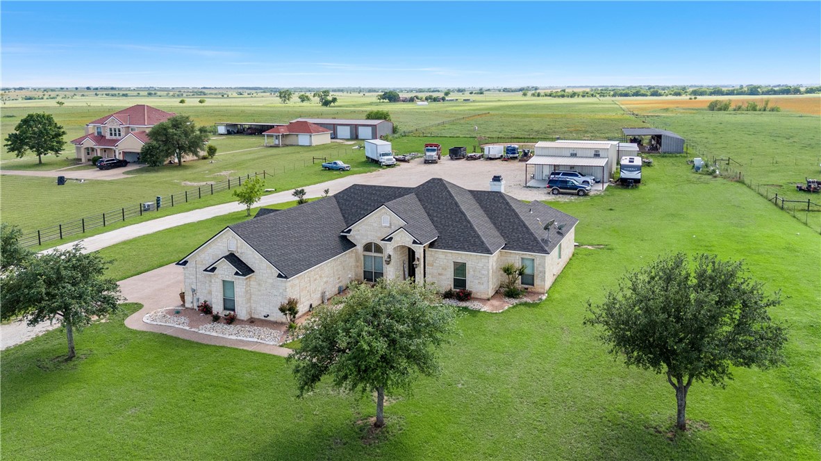 an aerial view of a house with a garden