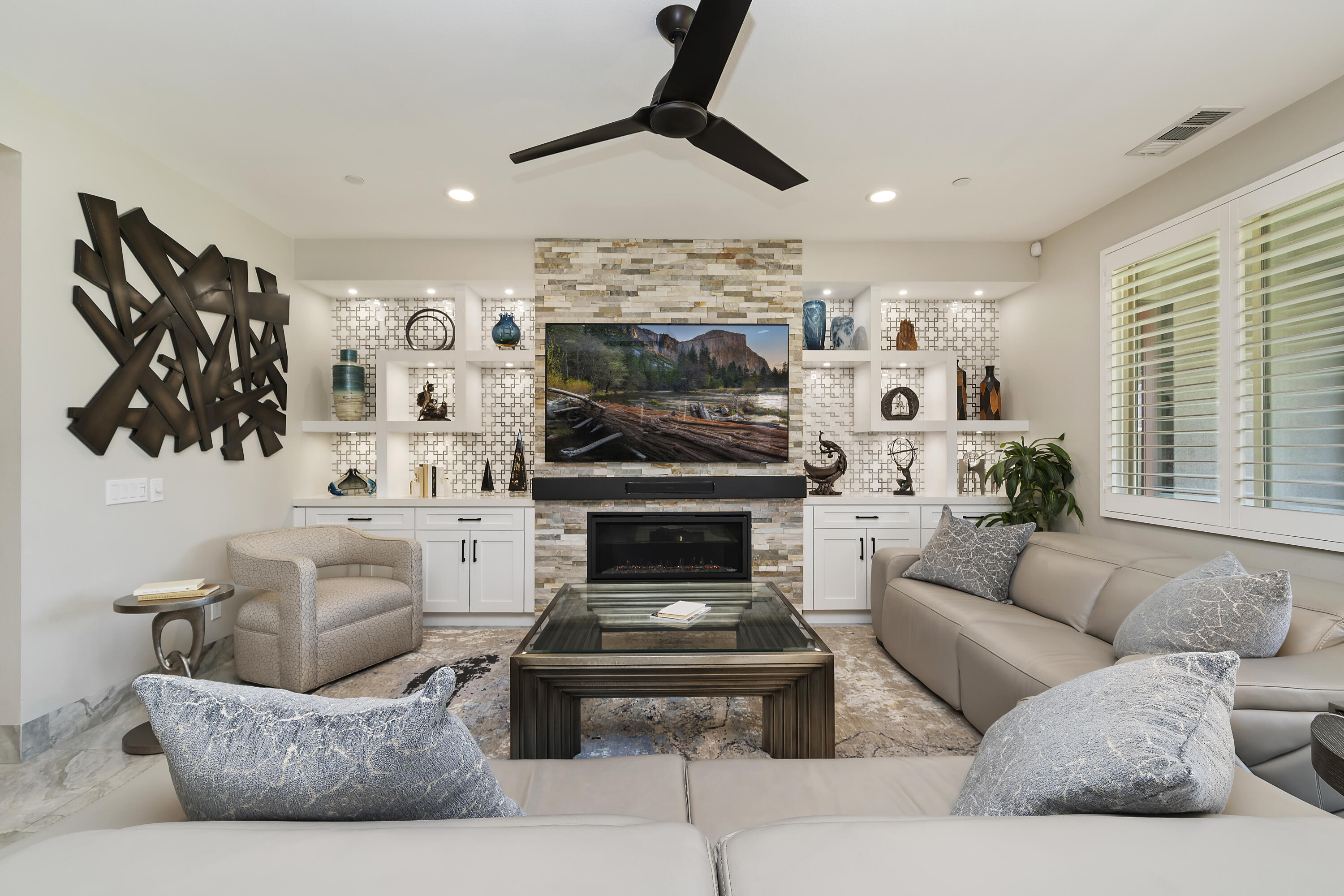 a living room with furniture and a fireplace