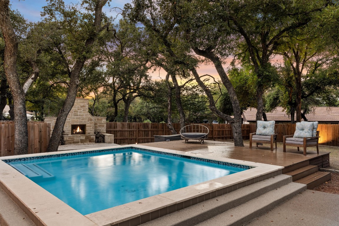 a view of a swimming pool with chairs