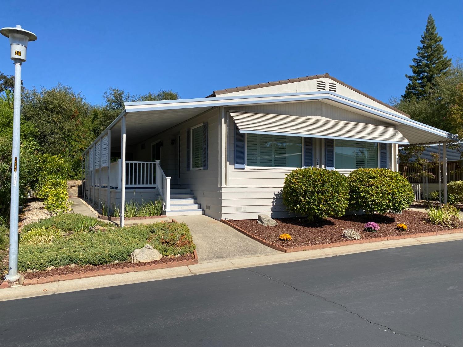 a front view of a house with a garden