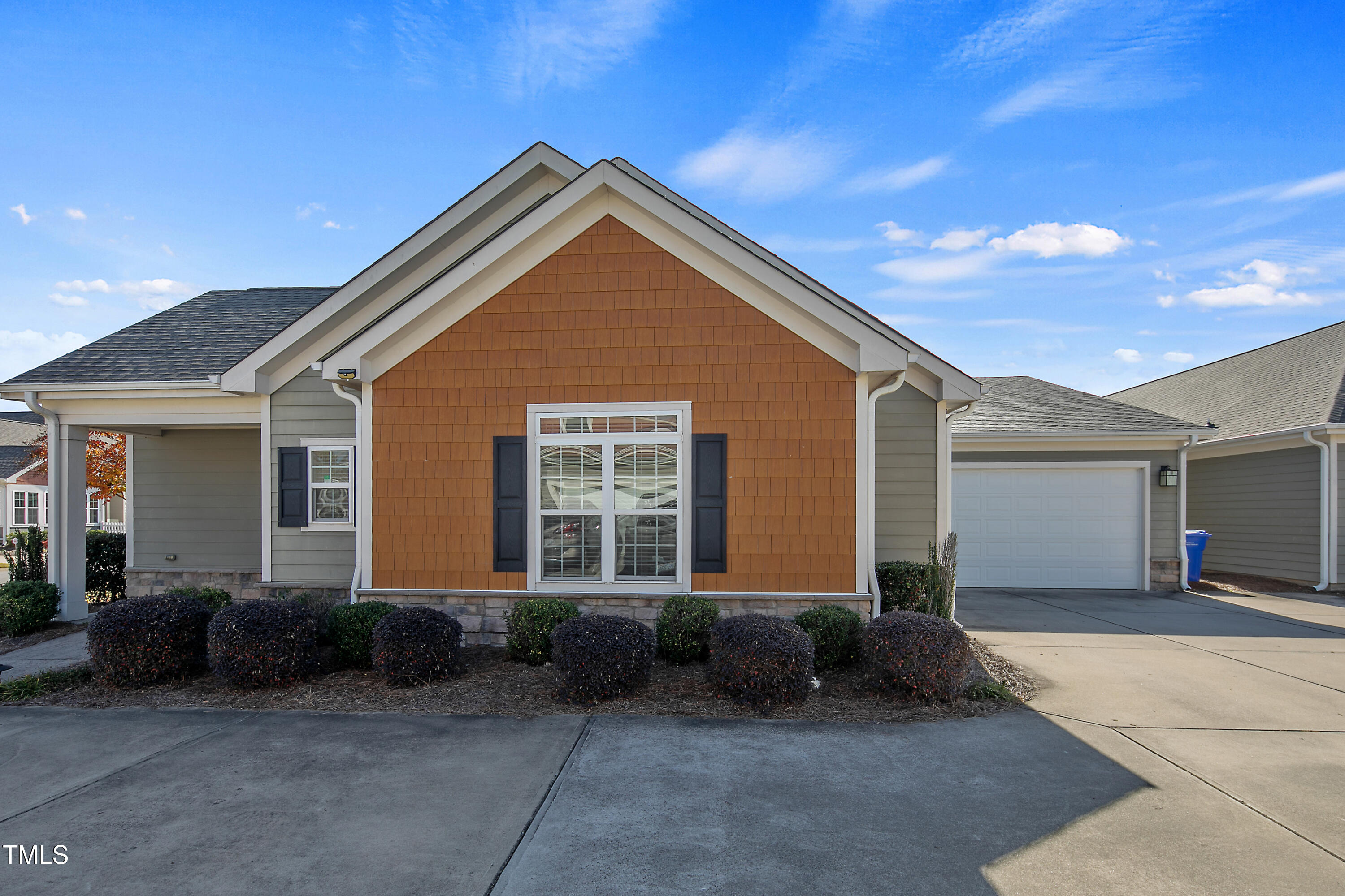 a front view of a house with a garage