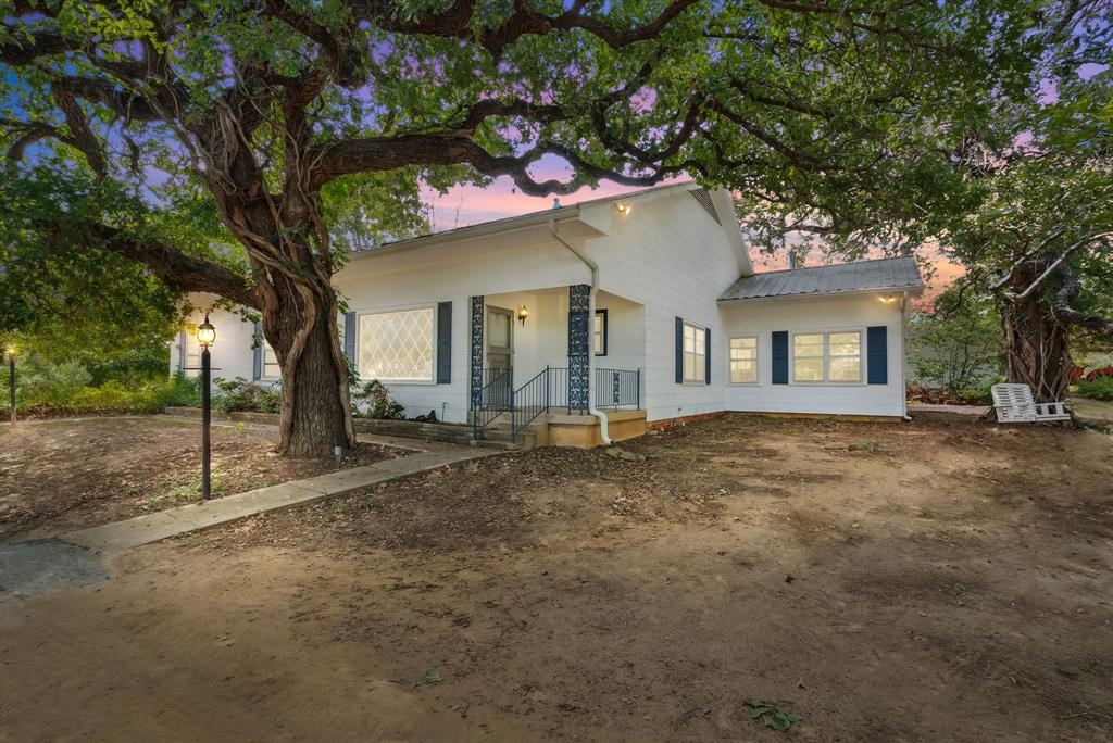 a house with trees in front of it