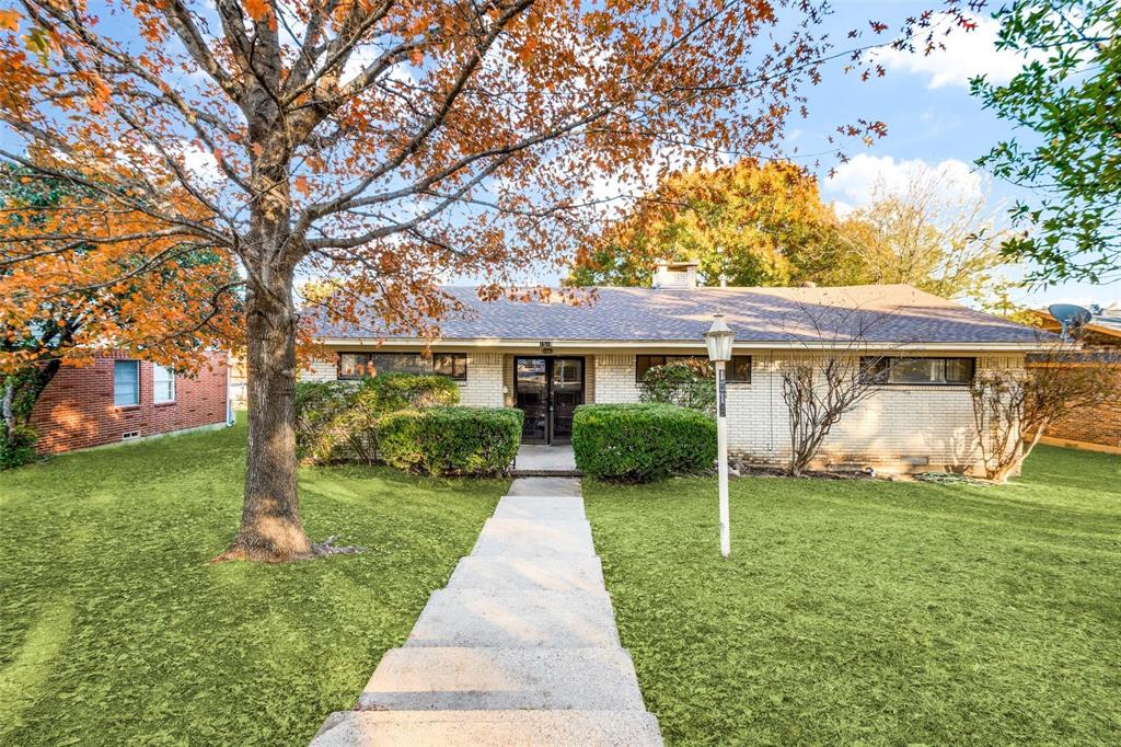 front view of a house with a yard