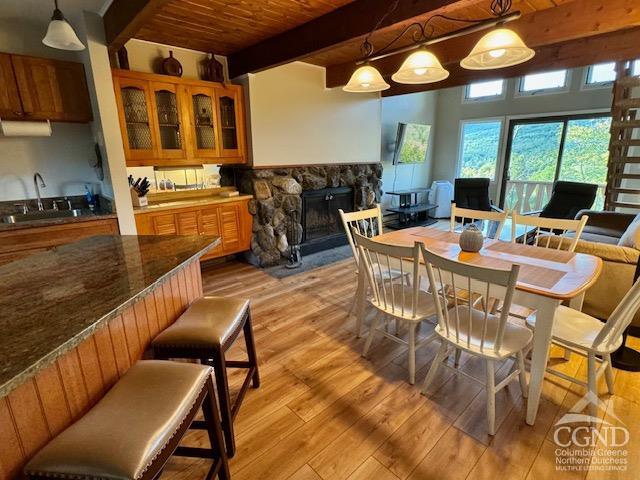 a dining room with furniture and wooden floor