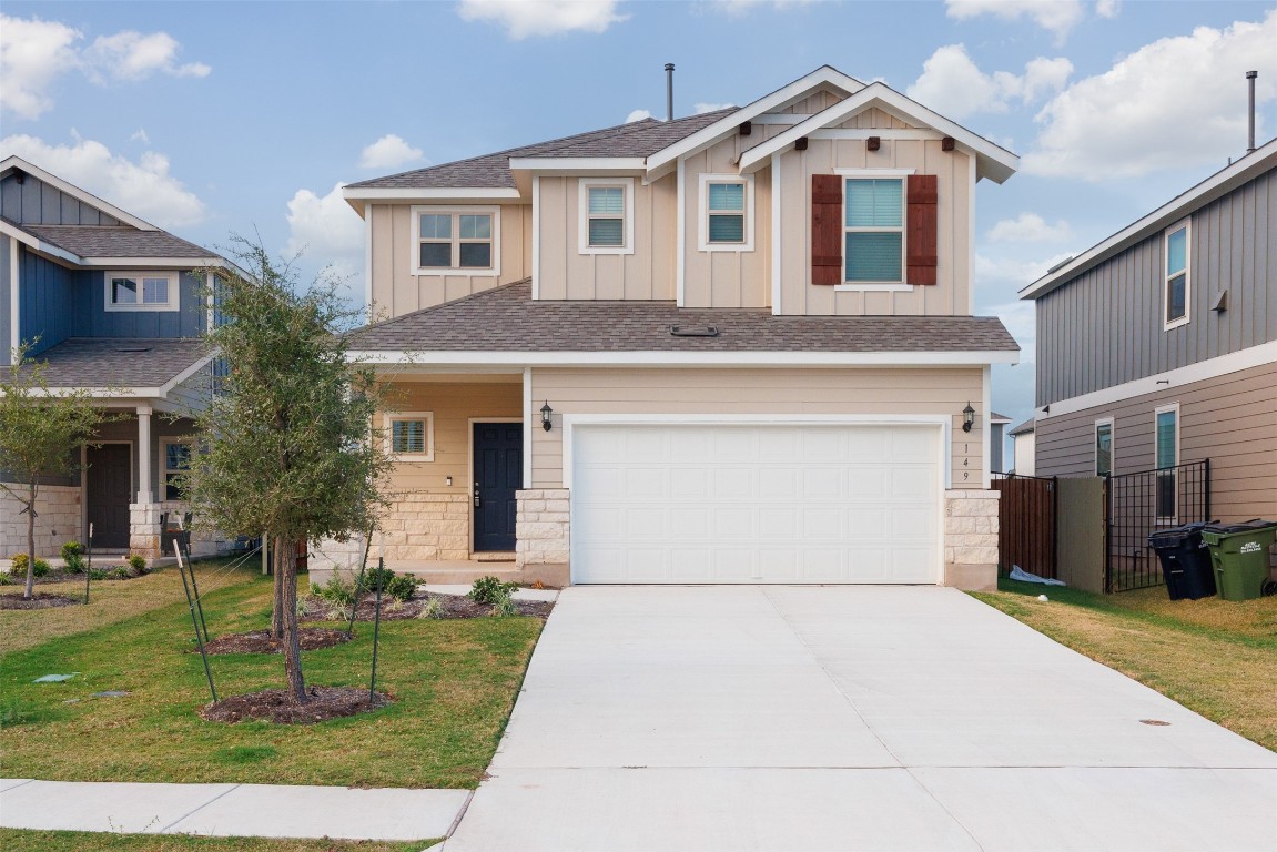 a front view of a house with a yard