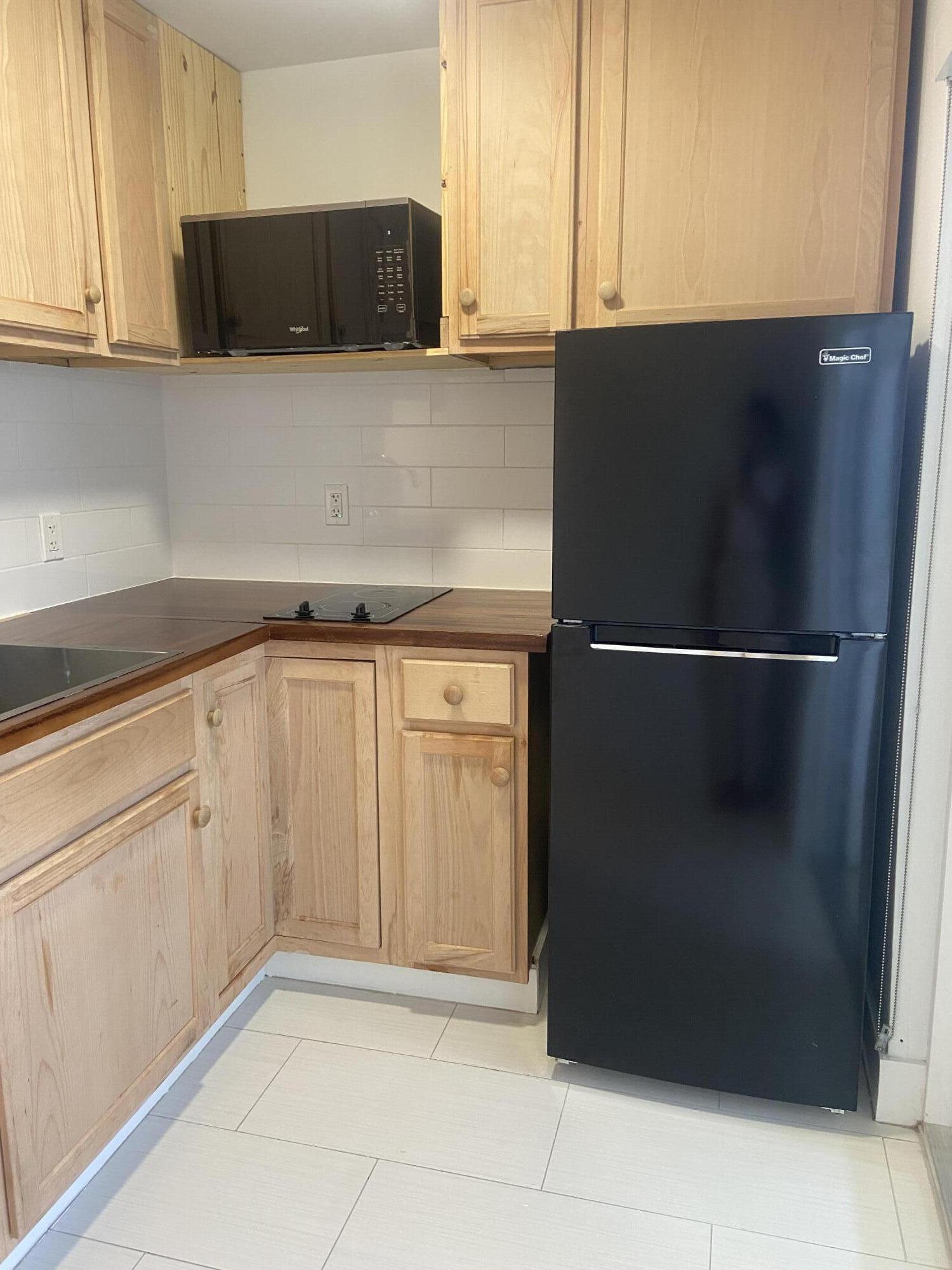 a kitchen with a cabinets and a stove