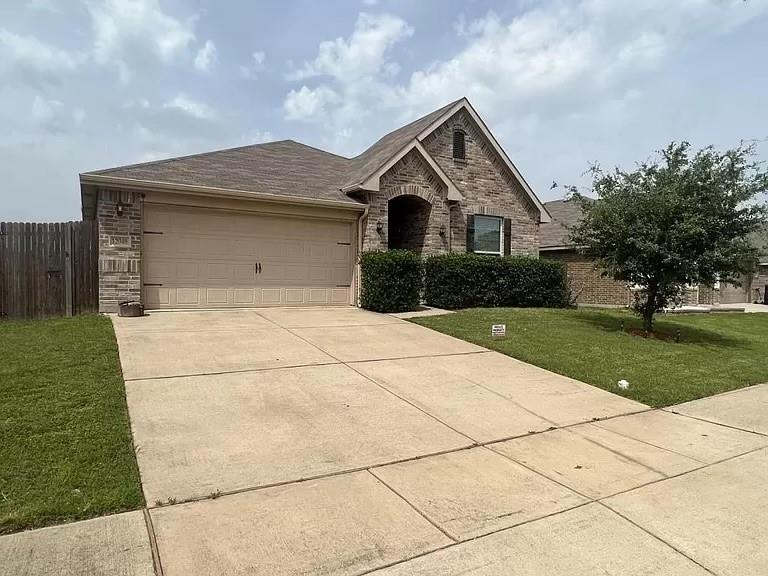 a front view of a house with yard