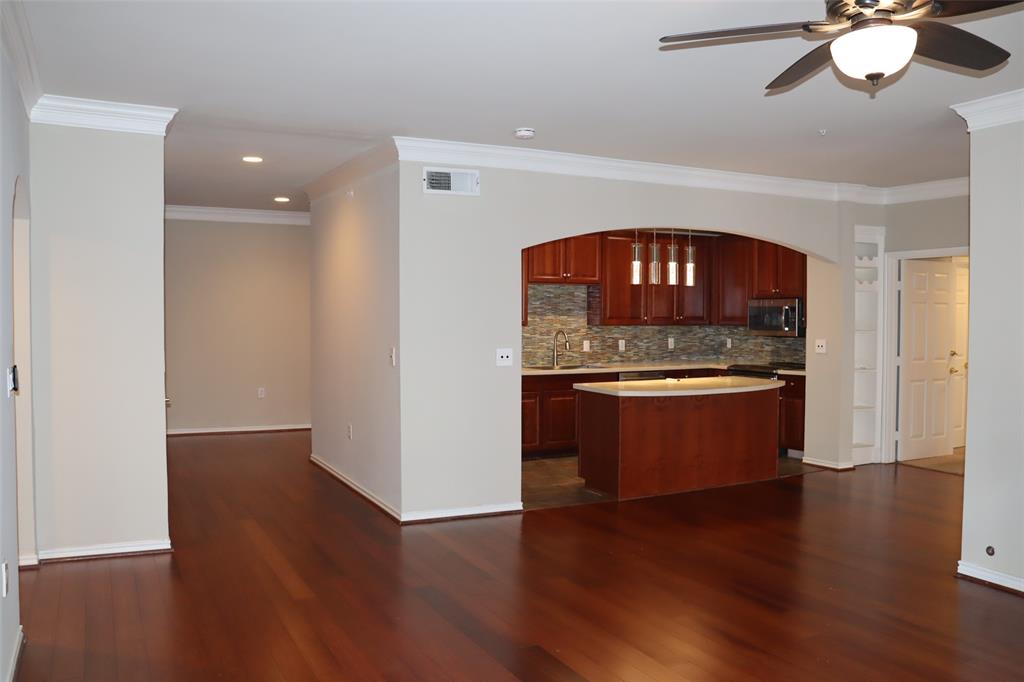 a view of kitchen with sink and wooden floor