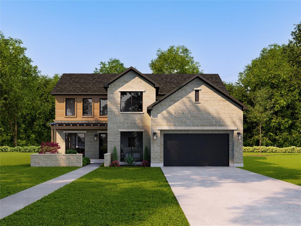 a front view of a house with a garden and yard