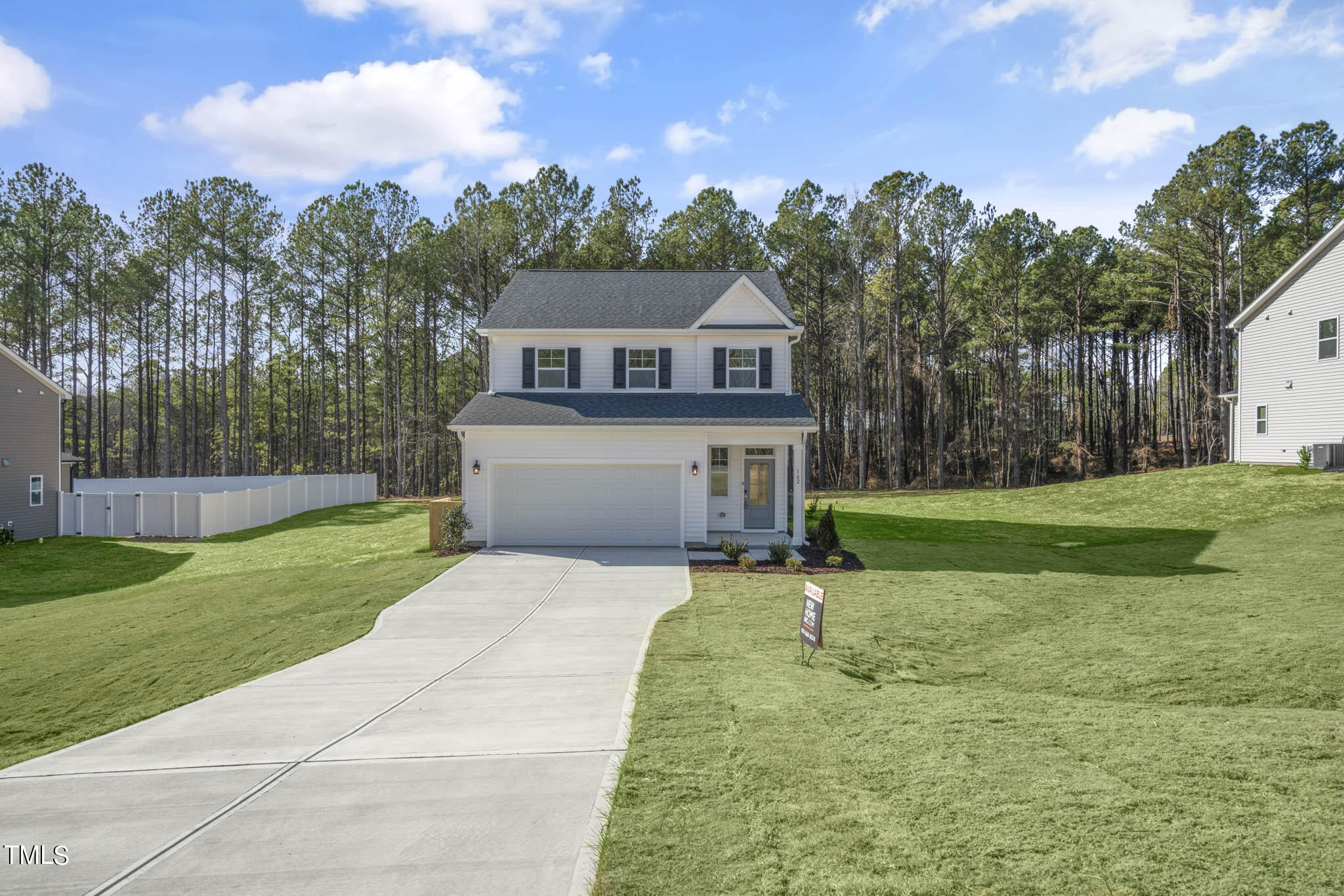 a house view with a garden space