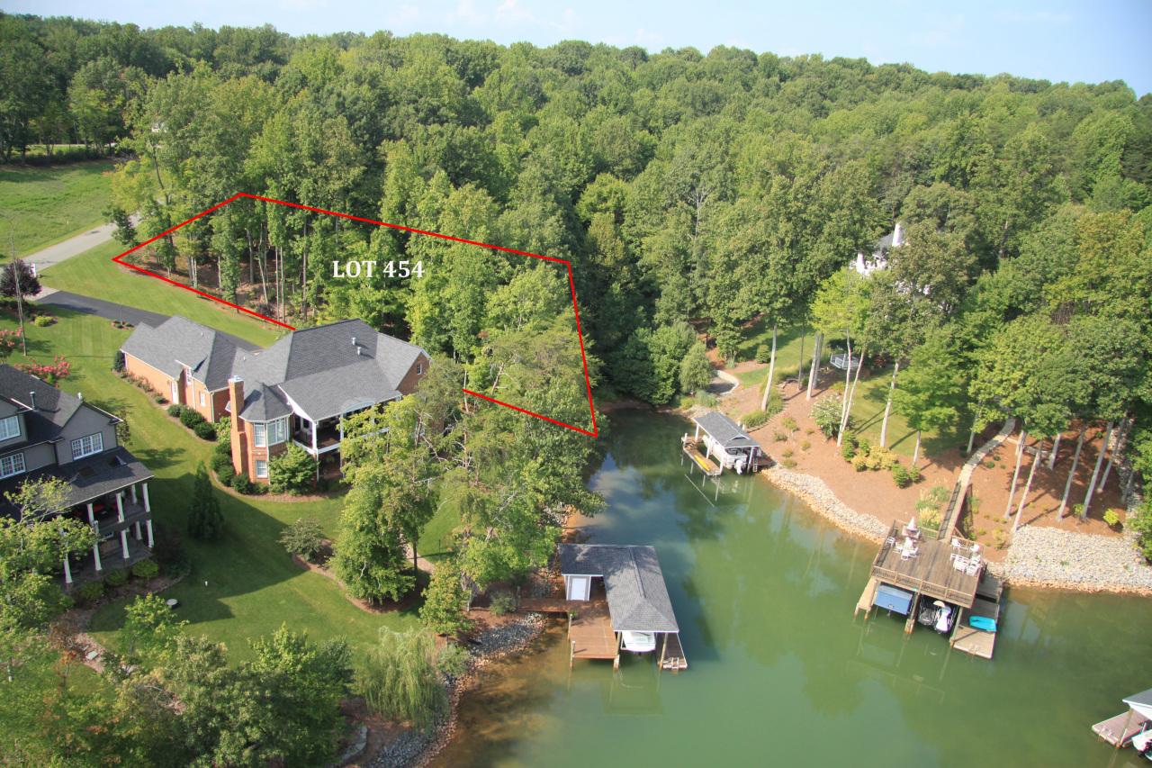 an aerial view of lake residential house with outdoor space and trees around