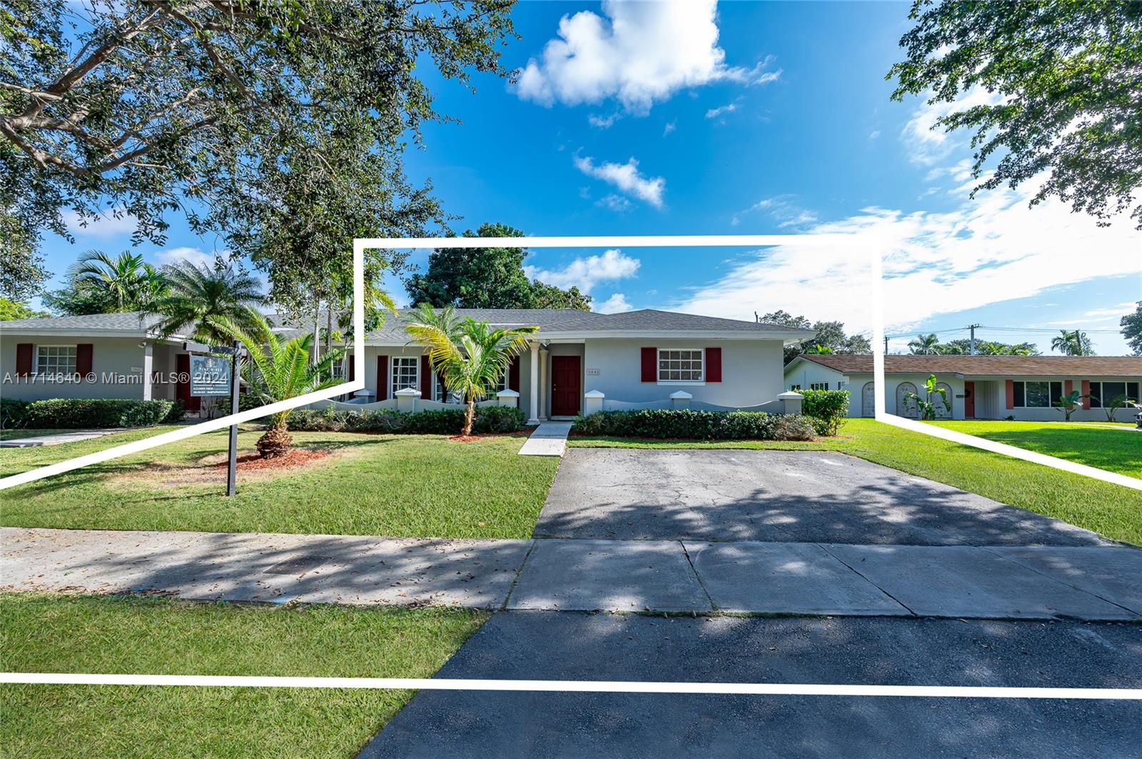 a view of a house with a backyard