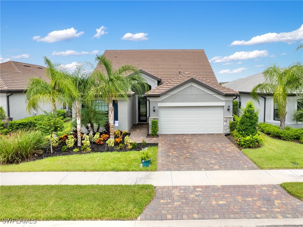 a view of a house with a yard and plants