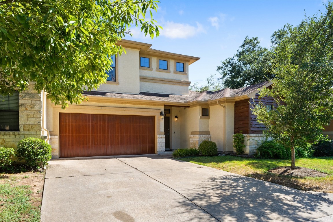 Gorgeous condo with beautiful trees and landscaping.