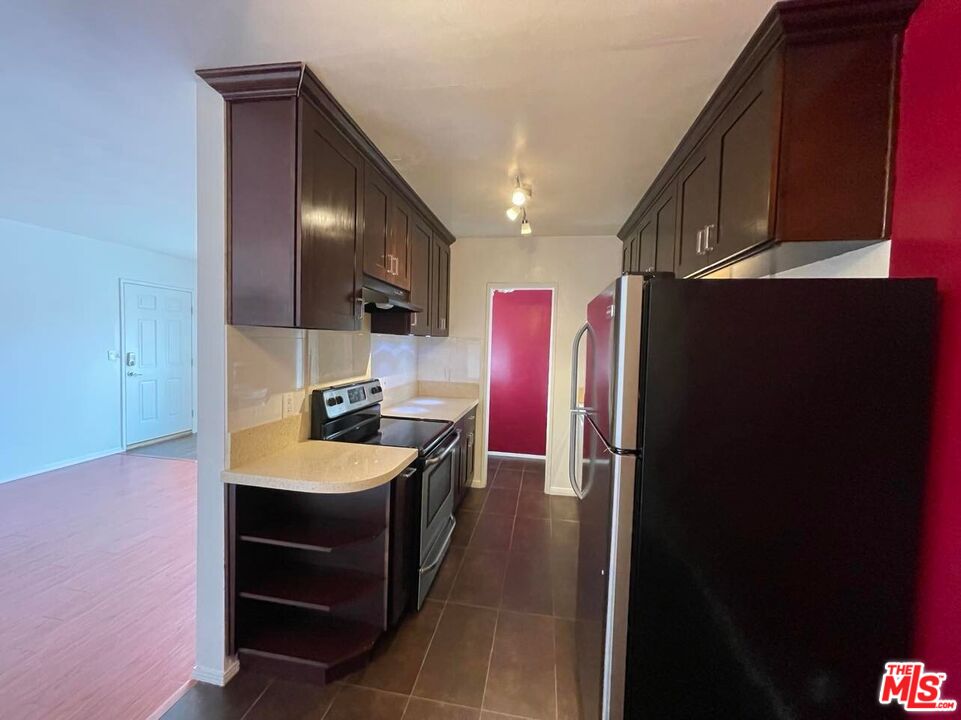 a spacious bathroom with a sink and a mirror