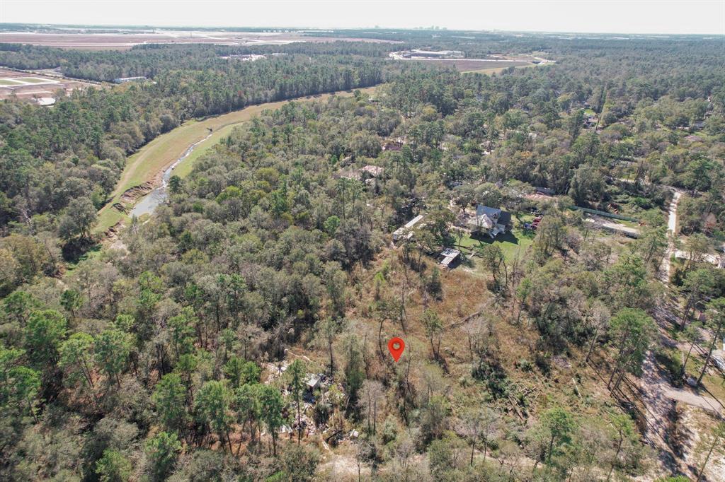 an aerial view of houses with yard