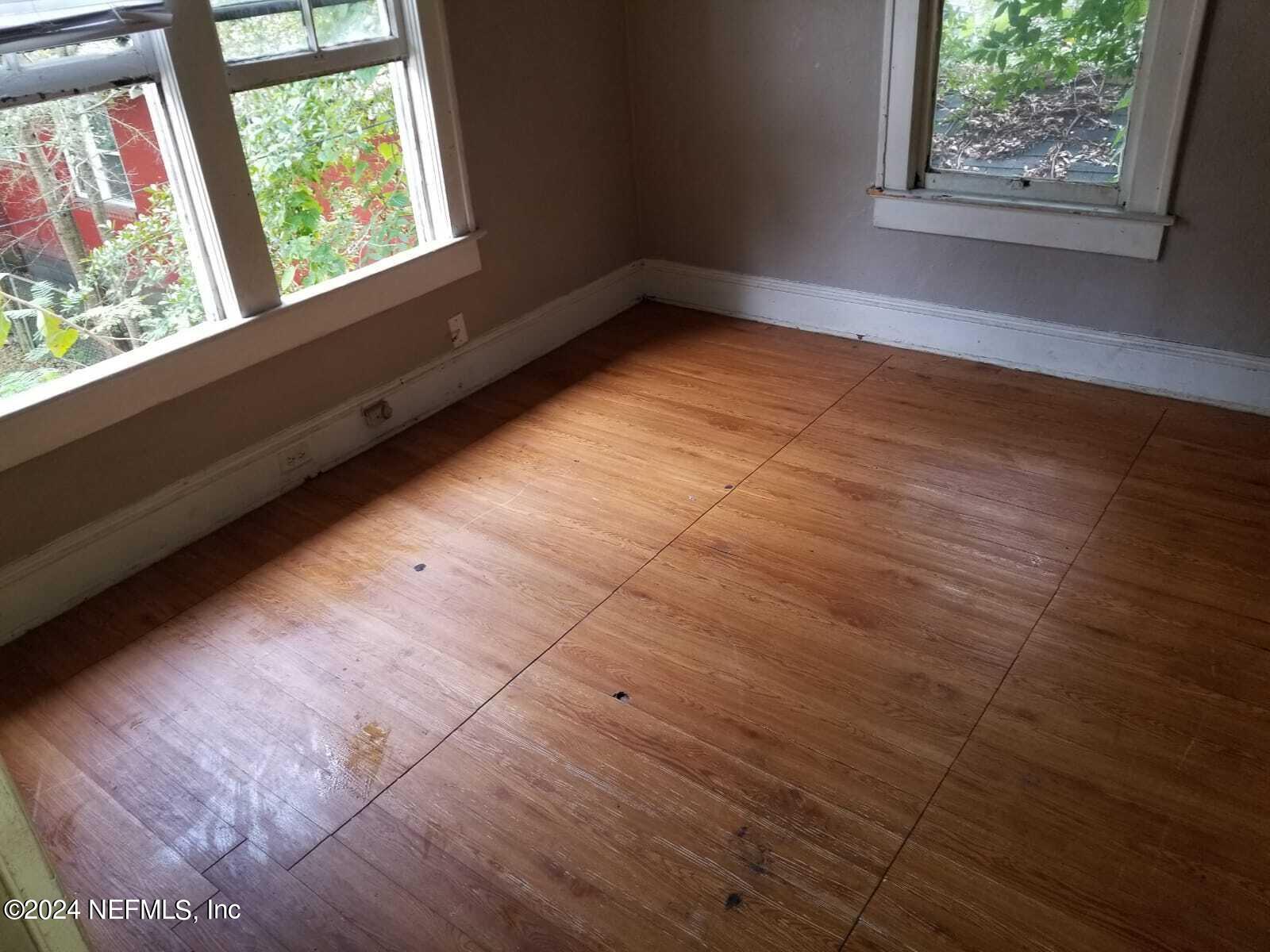 a view of an empty room and window