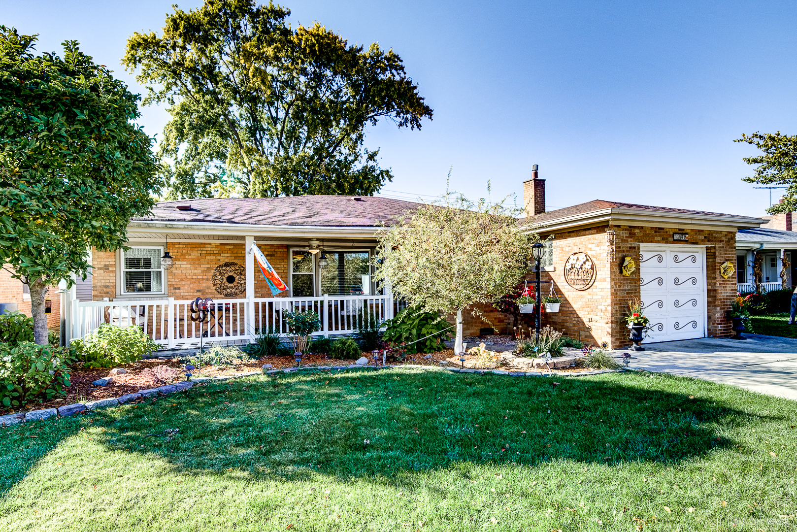 a view of a house with a yard and plants