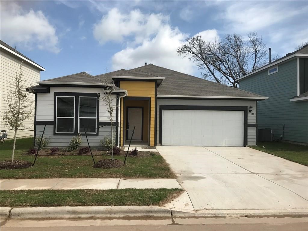 a front view of a house with garage