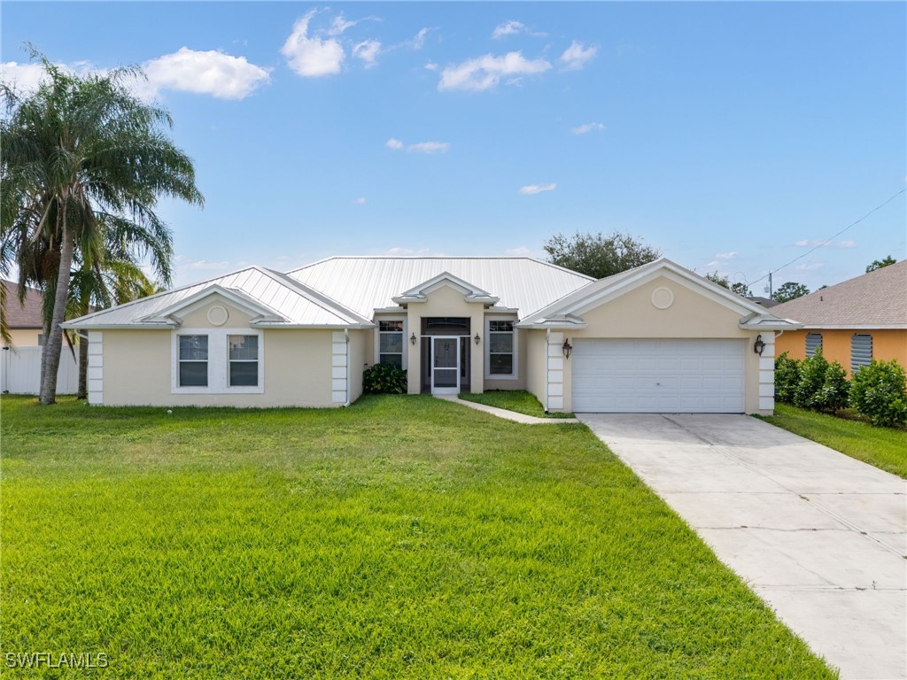 a front view of a house with yard