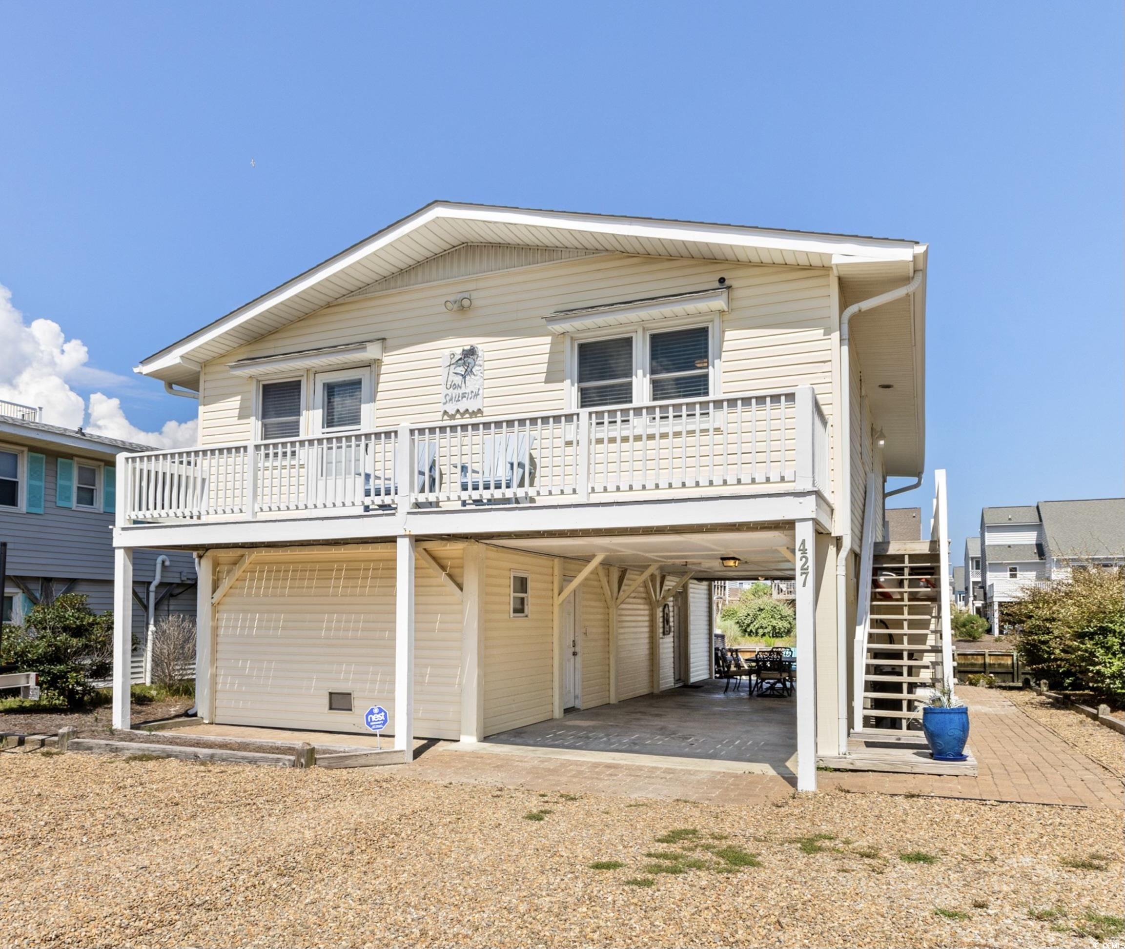 View of front of house featuring a carport