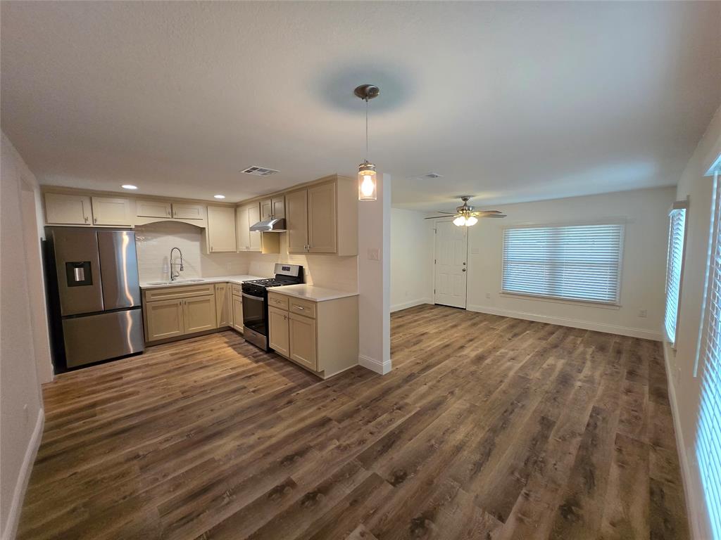 a view of kitchen with wooden floor