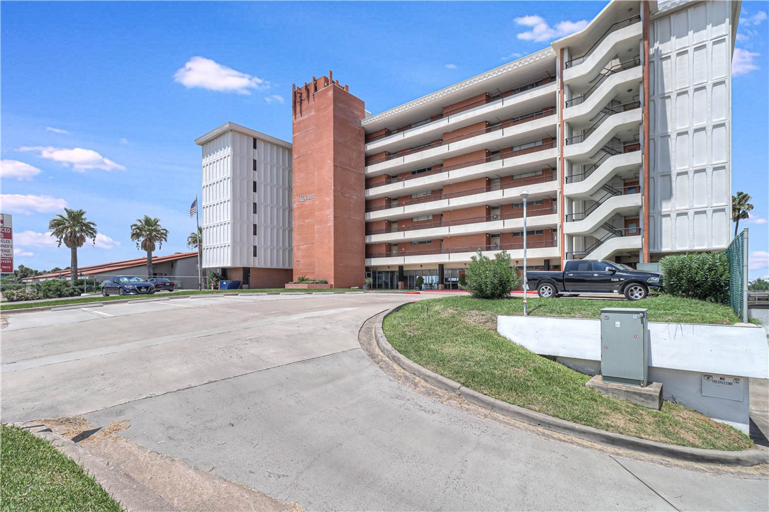 a front view of a building with garden