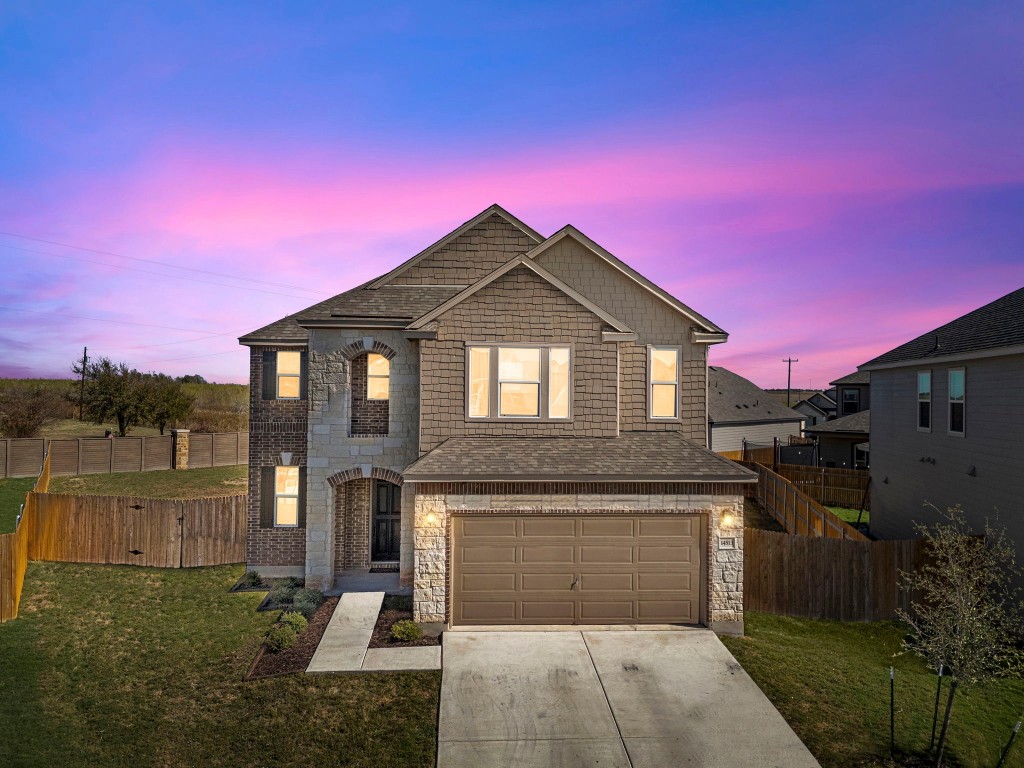 a front view of a house with a yard