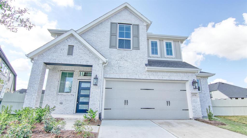 a front view of a house with a garage