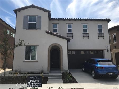 a front view of a house with parking