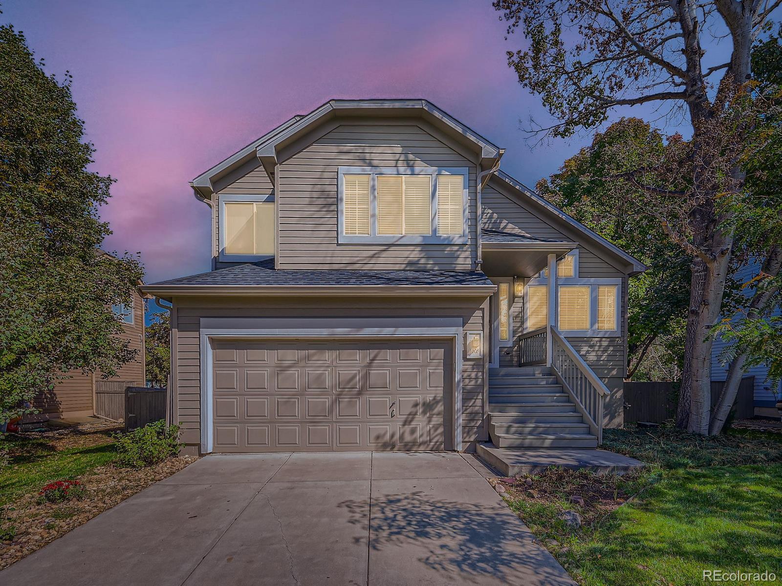 a front view of a house with yard