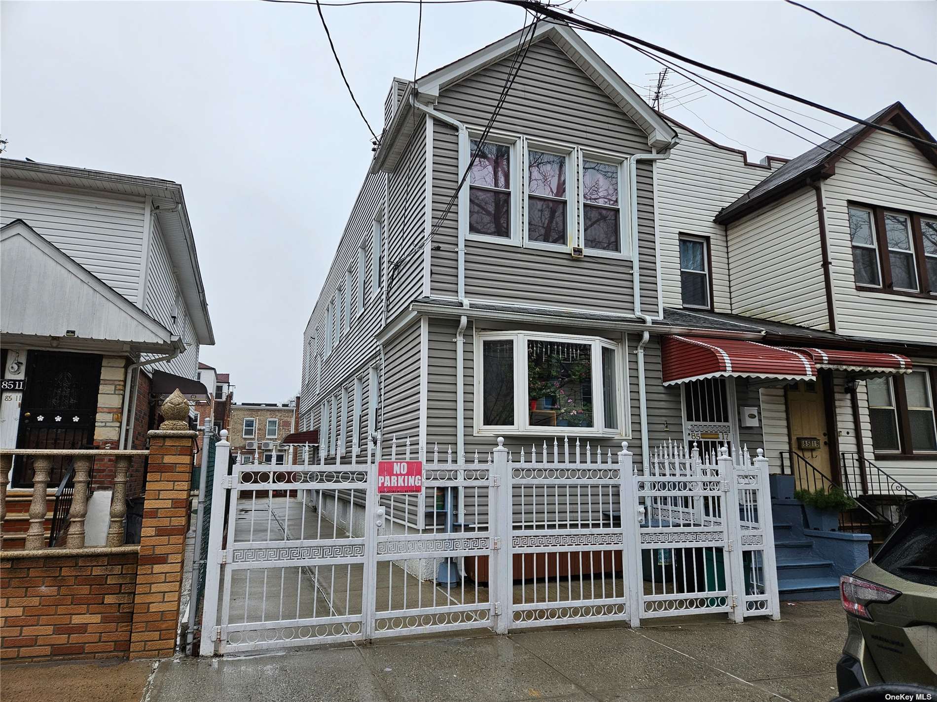 a front view of residential houses with stairs