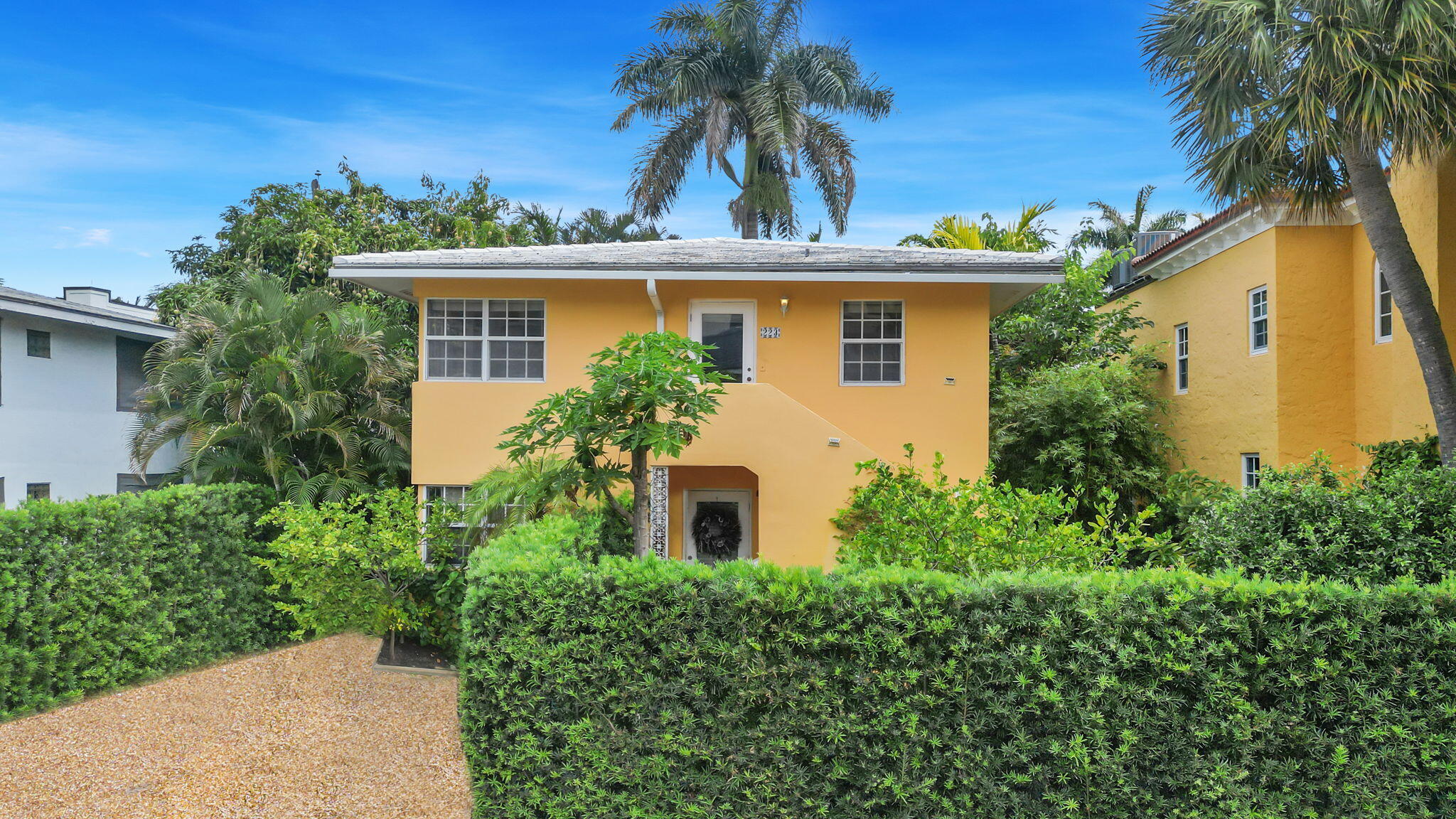 front view of a house with a garden