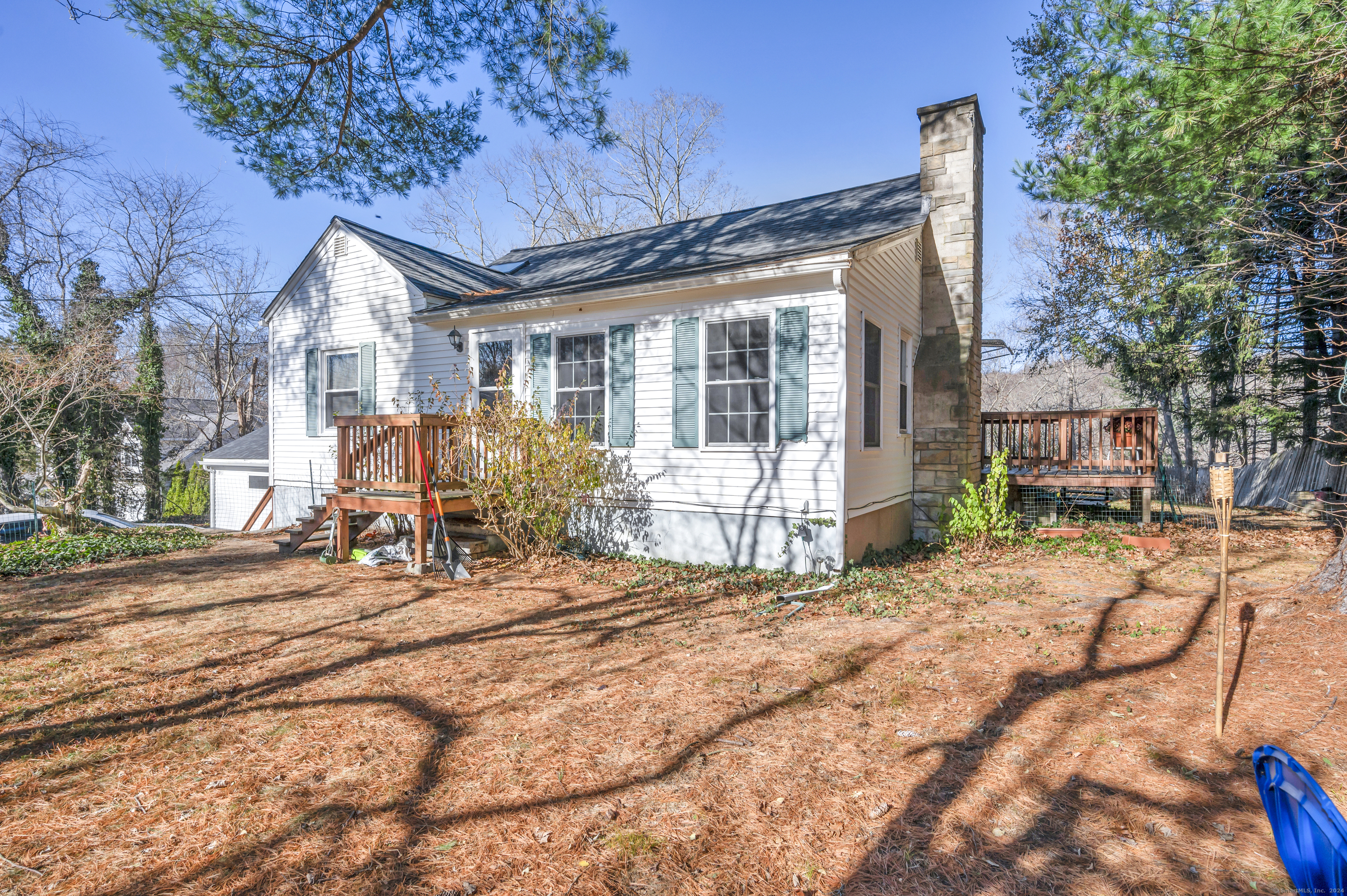 a view of a house with wooden fence