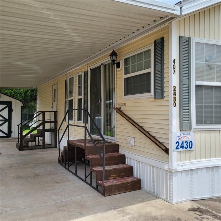 Property entrance with covered porch