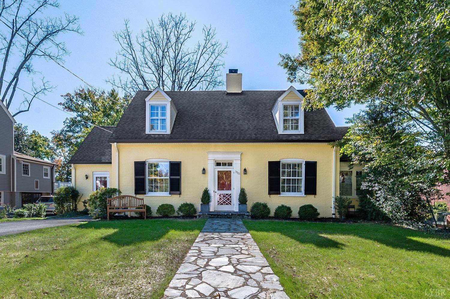 a front view of house with yard and green space