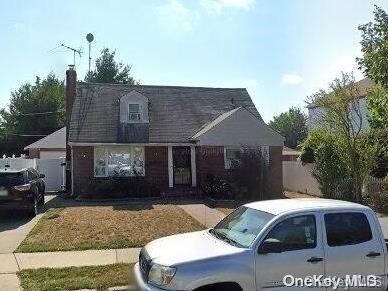 a front view of a house with yard