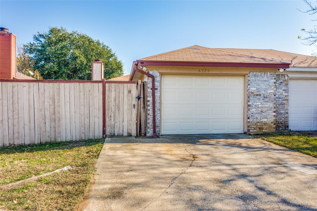 a front view of a house with a garage