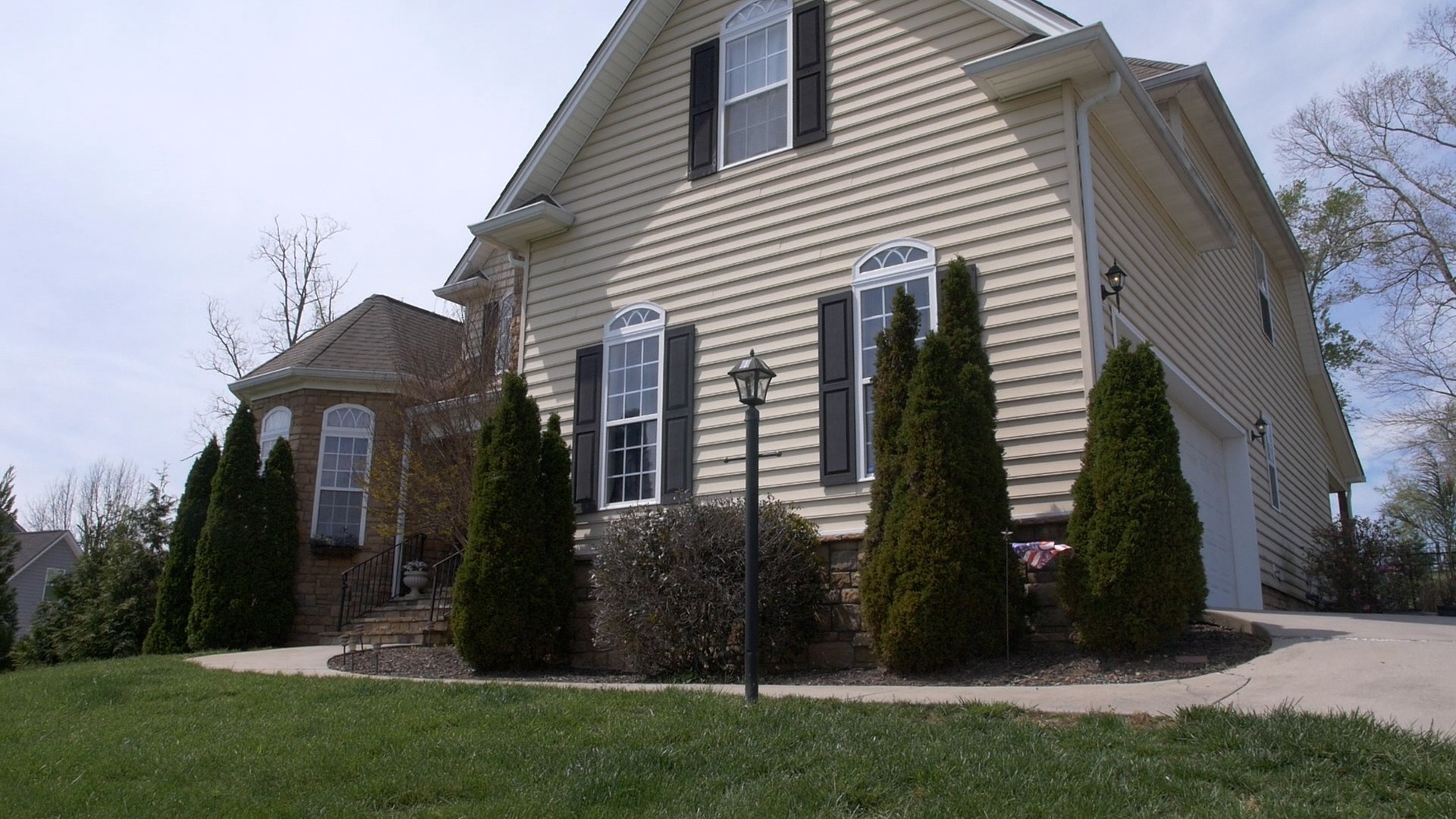 a front view of a house with garden