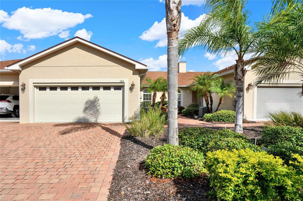 a view of a house with palm trees