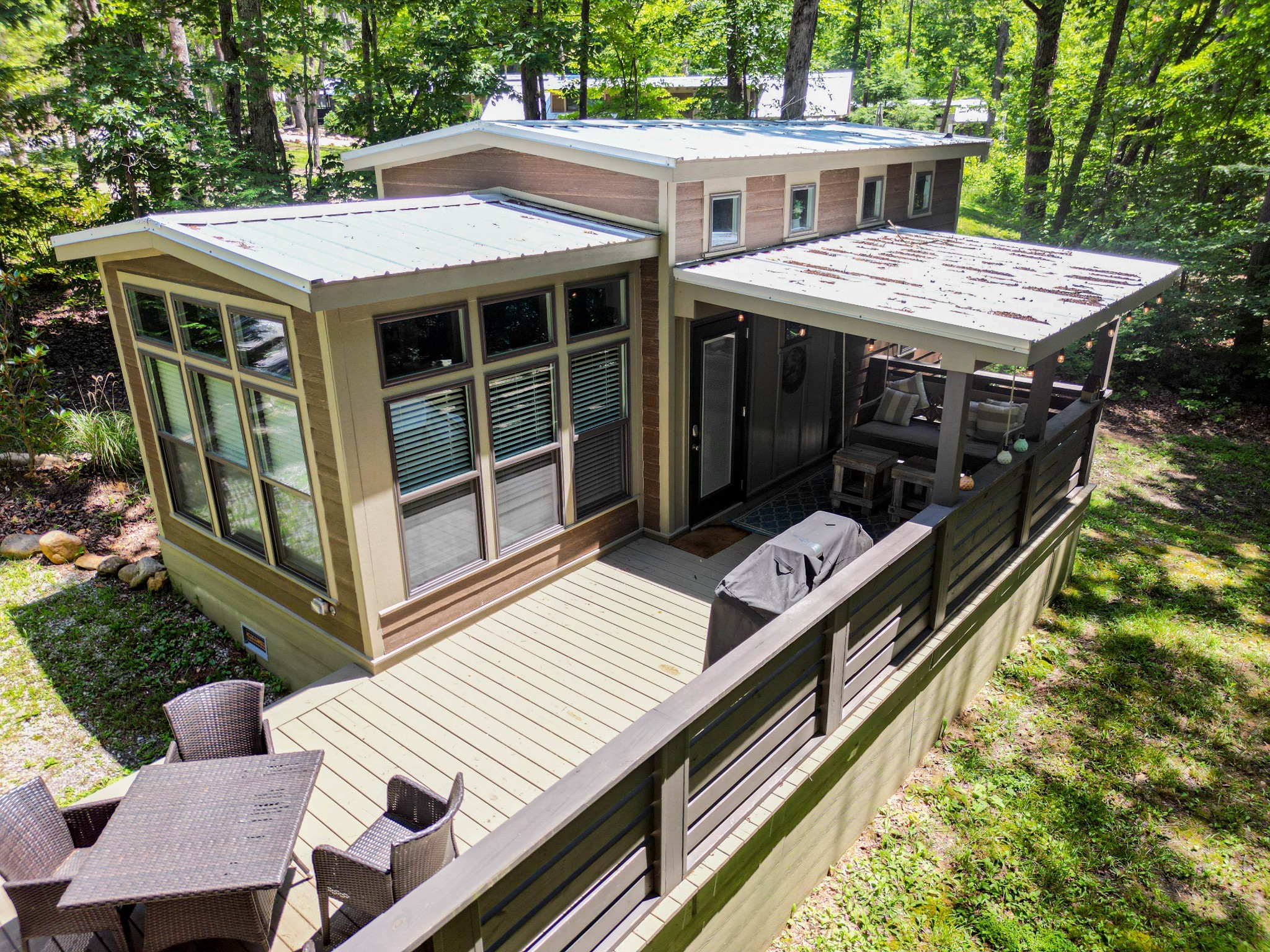 a view of a roof deck with wooden floor and fence