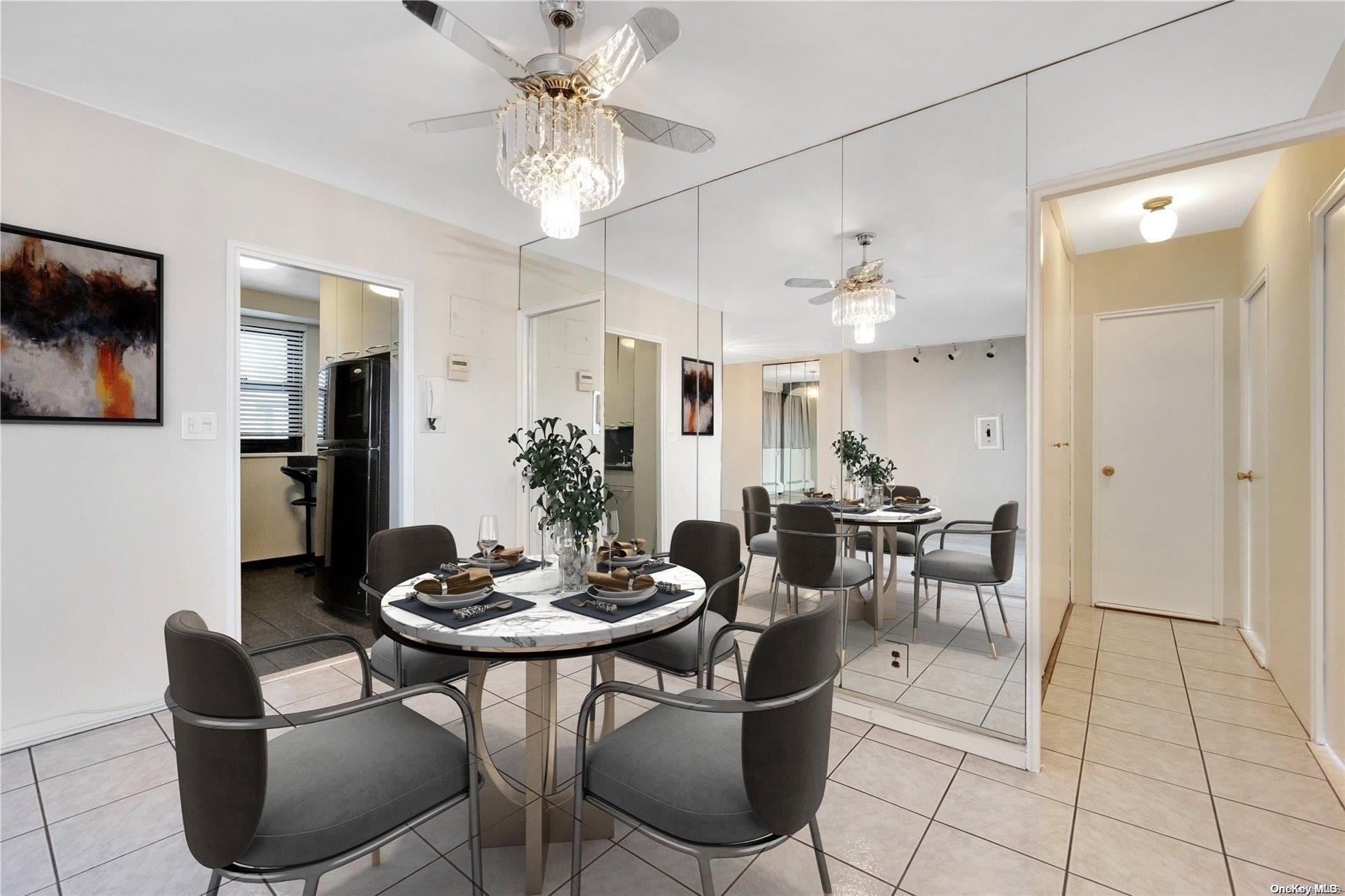 a view of a dining room with furniture and chandelier