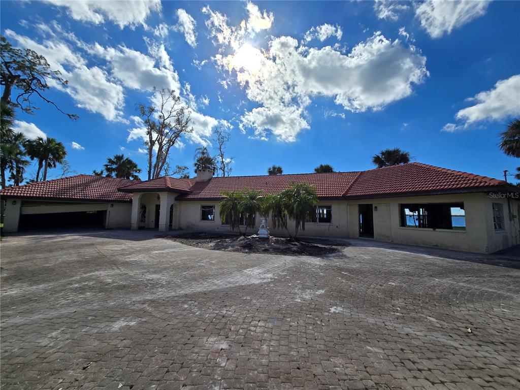 a front view of a house with yard