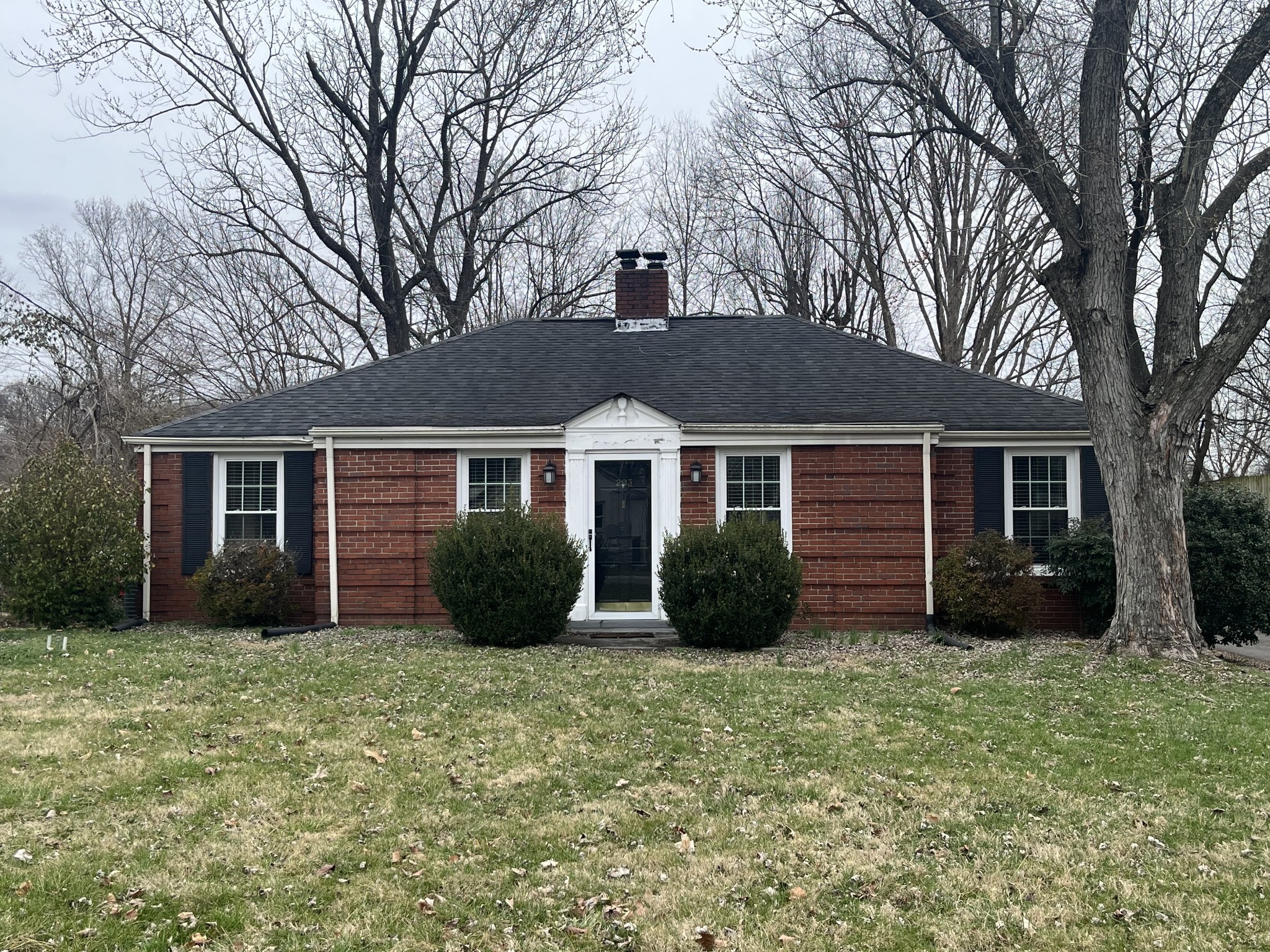 front view of a house with a yard