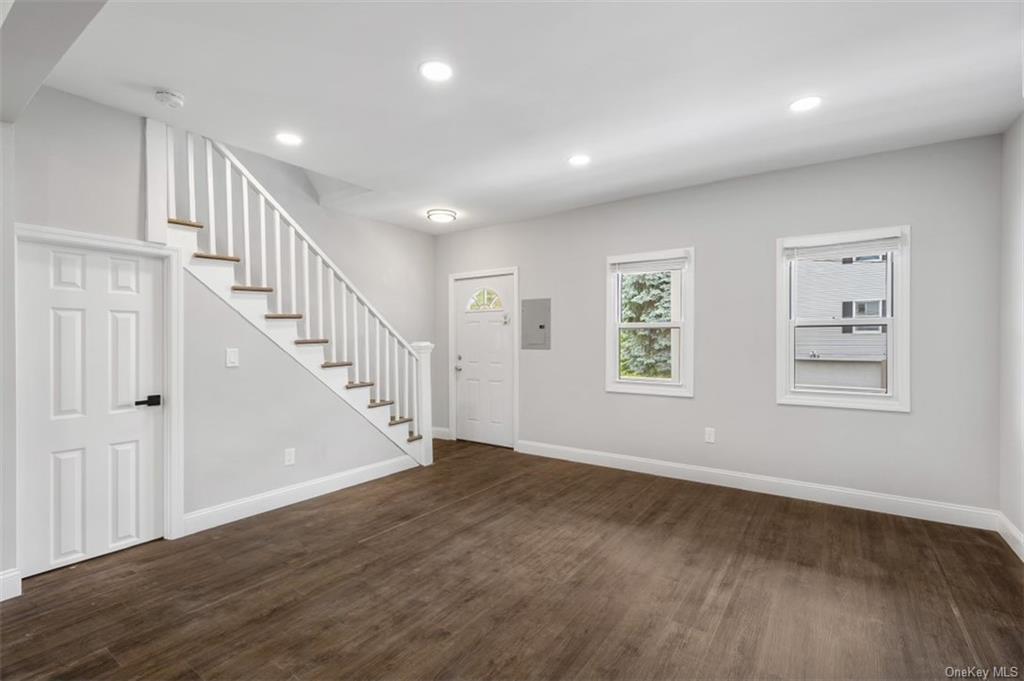 Foyer featuring dark hardwood / wood-style floors and electric panel