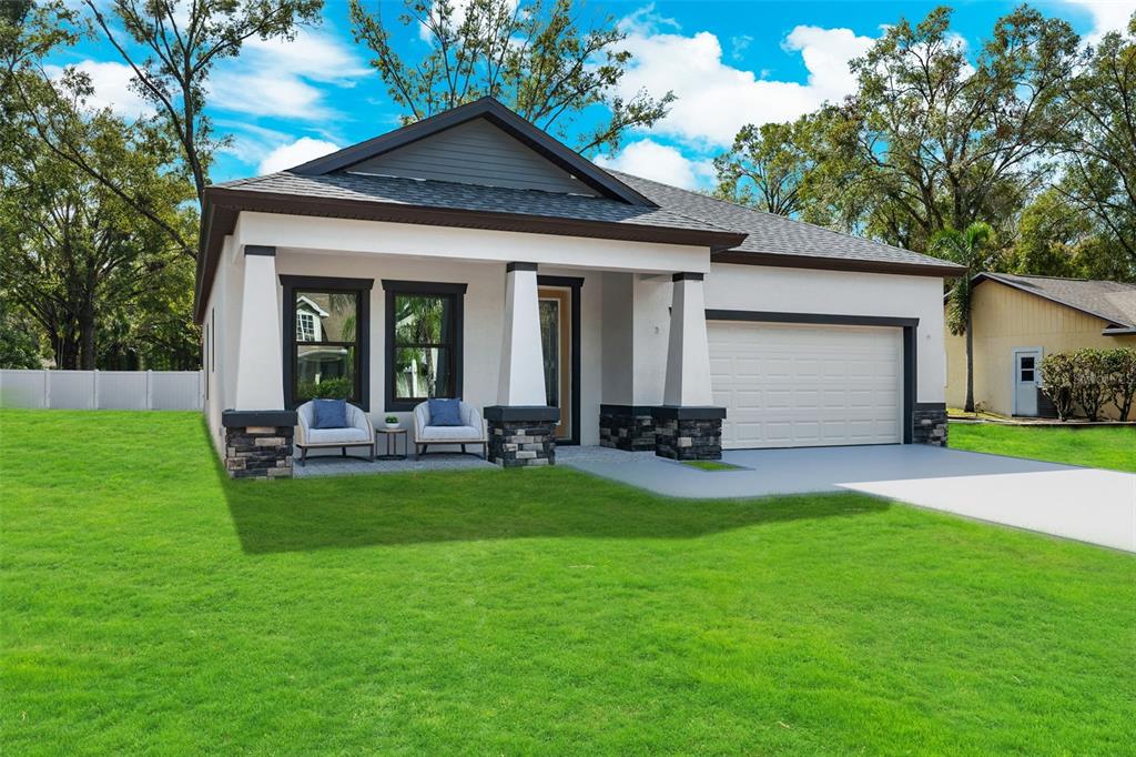 a view of a house with a yard patio and a garden