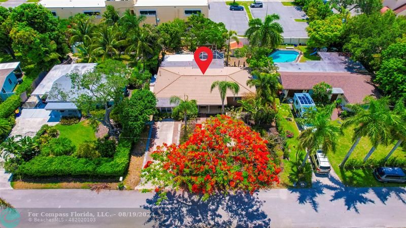 an aerial view of house with yard