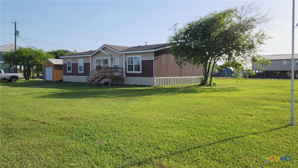 a view of a house with a big yard